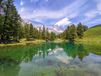 View of the scenic blue lake lago blu surrounded by a beautiful alpine landscape, aosta valley