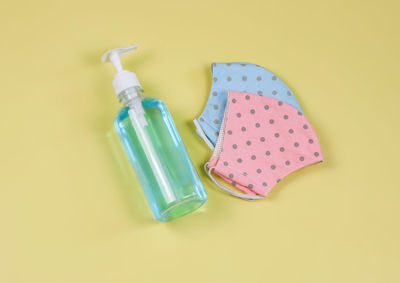 High angle view of plastic bottle on green background