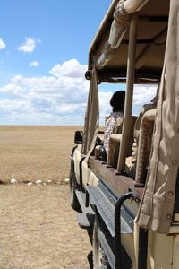 Tractor on field against sky