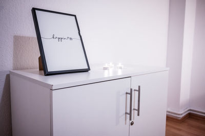 Low angle view of electric lamp on table at home
