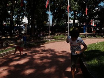 Boy standing on tree