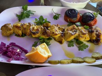 High angle view of fruits in plate on table