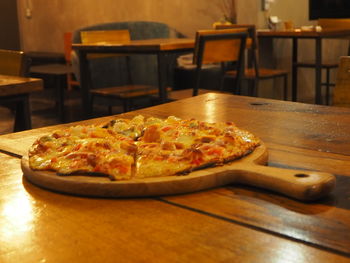 Close-up of pizza in plate on table