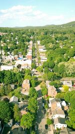 High angle view of houses on field against sky