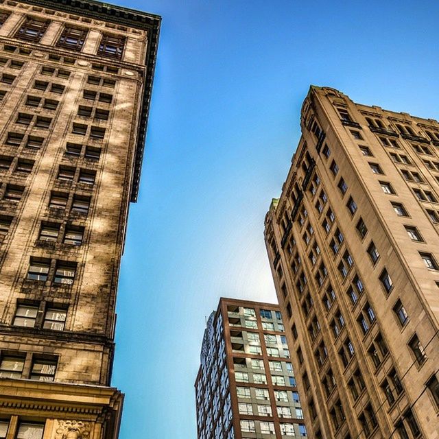 architecture, building exterior, built structure, low angle view, clear sky, window, city, building, tall - high, tower, skyscraper, blue, modern, office building, day, glass - material, outdoors, no people, sky, residential building