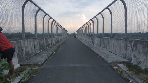 Bridge over road against sky