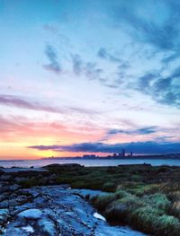 Scenic view of beach against sky during sunset