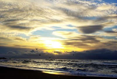 View of sea against sunset sky