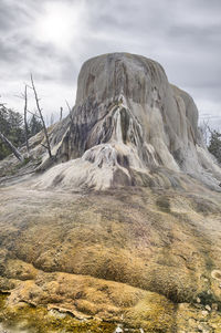 Landscape against sky at mammoth hot springs