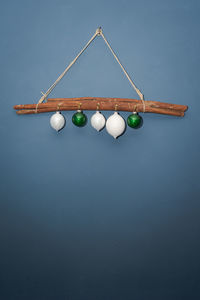 High angle view of decoration on table against blue background