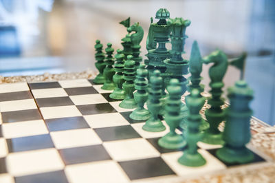 Close-up of chess pieces on chess board