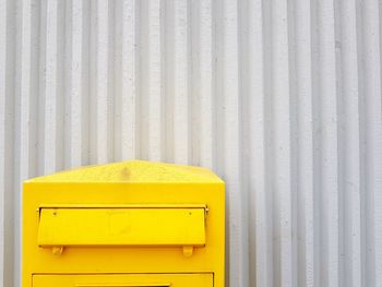 Close-up of yellow mailbox