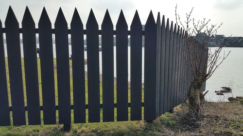 Close-up of metal structure against sky