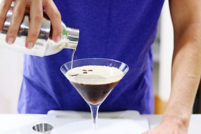 Midsection of man holding ice cream