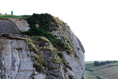 Low angle view of rock formations against sky