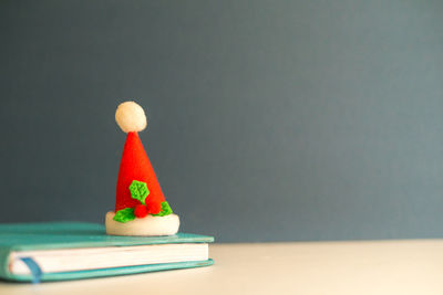 Close-up of cupcakes on table against colored background