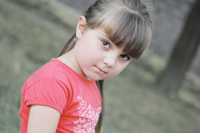 Portrait of cute girl standing outdoors