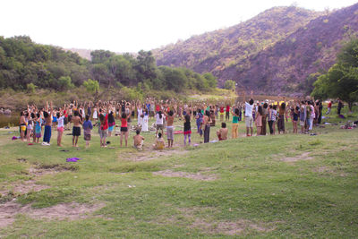 People on grassy field