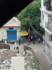 People in front of building against sky