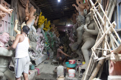 Clay idol of goddess durga, under preparation for bengal's durga puja festival at kumartuli kolkata.