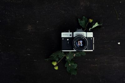 View of camera against black and white wall