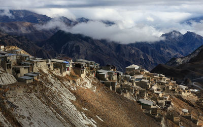 Scenic view of mountains against cloudy sky