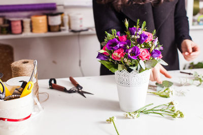 Close-up of flower vase on table