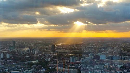 Cityscape against sky during sunset