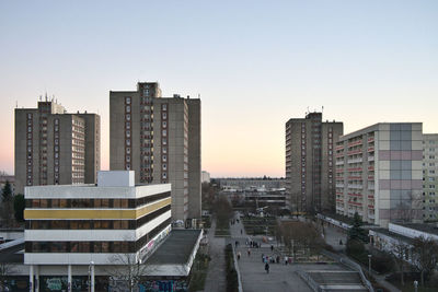 High angle view of buildings in city against clear sky