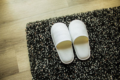 High angle view of shoes on hardwood floor