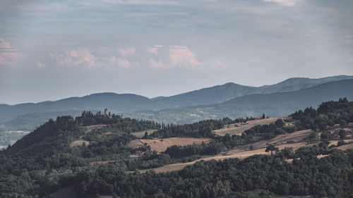 Scenic view of landscape and mountains against sky