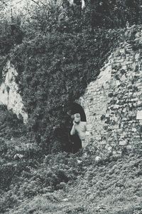 Woman standing in forest