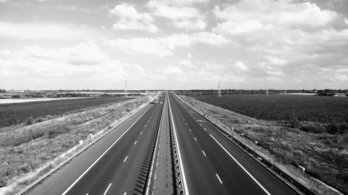 Road amidst landscape against sky