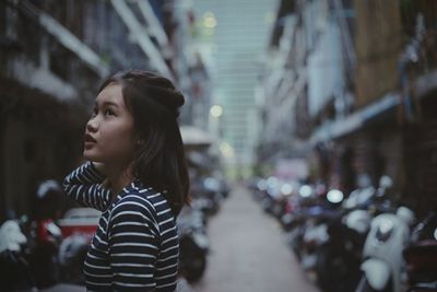 Woman in city at night