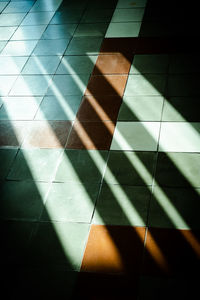 Full frame shot of sunlight falling on tiled floor