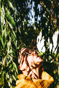 Portrait of woman on tree