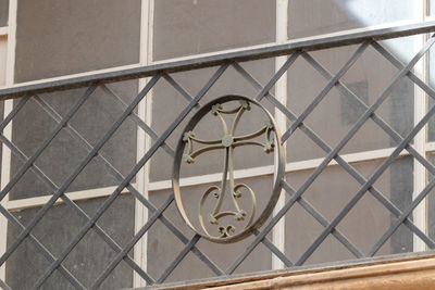 Low angle view of railing on window