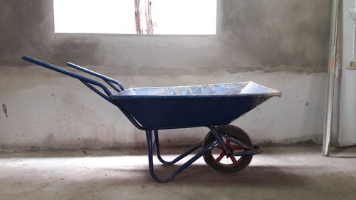 Wheelbarrow by window