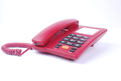 High angle view of telephone booth against white background