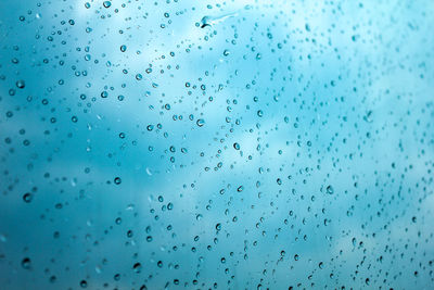 Full frame shot of wet glass window