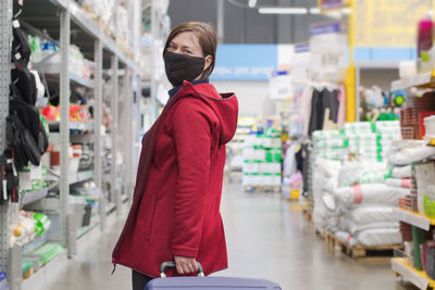 Rear view of woman standing in store