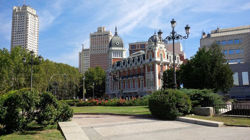 View of buildings against cloudy sky