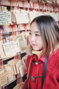 Young woman reading prayer blocks