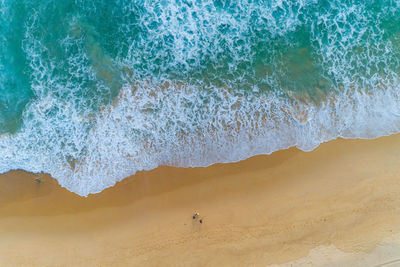 High angle view of waves on beach