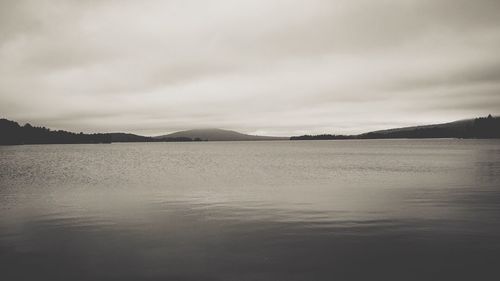 View of lake against cloudy sky