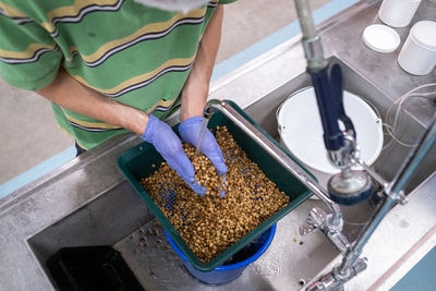 Low section of person preparing food