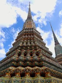 Low angle view of temple against cloudy sky