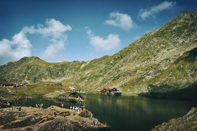 Scenic view of lake against cloudy sky