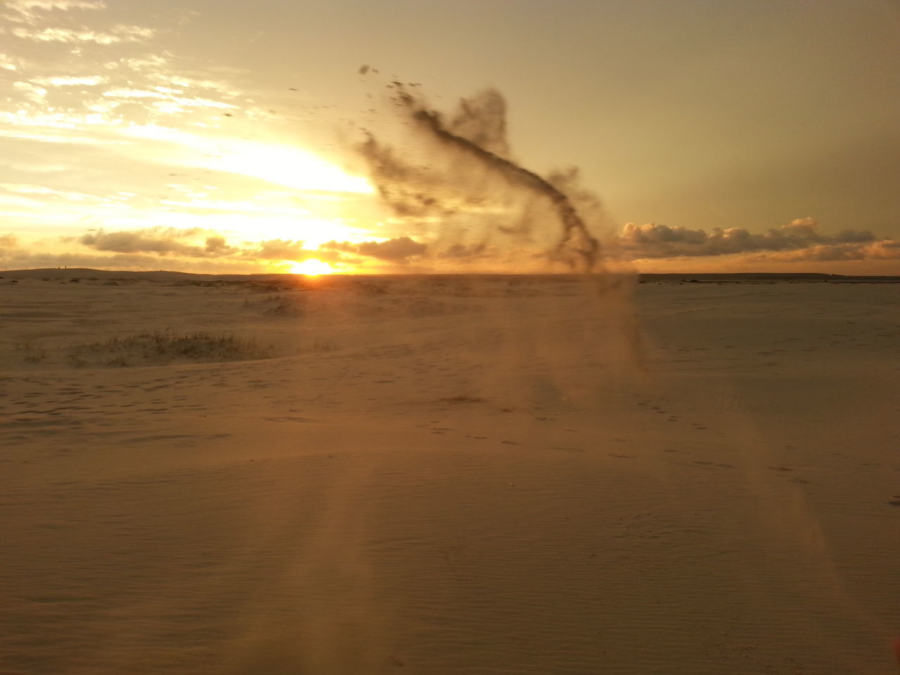 sunset, sky, scenics, beach, cloud - sky, sun, tranquil scene, sand, beauty in nature, sea, orange color, tranquility, water, nature, sunlight, shore, idyllic, sunbeam, horizon over water, cloudy