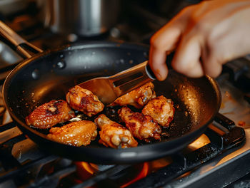 Midsection of man preparing food in kitchen